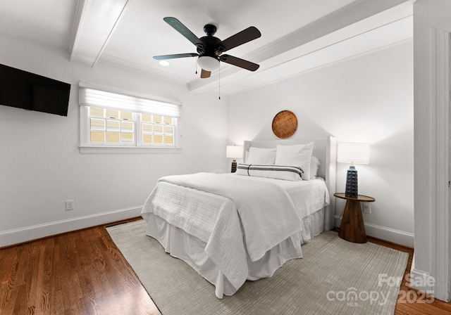 236 Wales Ave, Charlotte, NC 28209 - bedroom featuring beamed ceiling, baseboards, wood finished floors, and ceiling fan