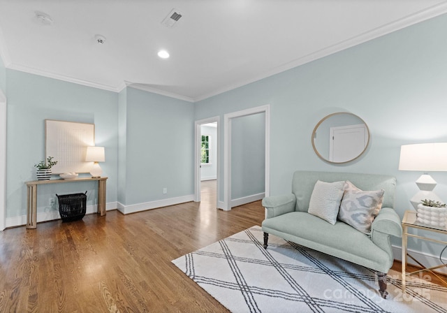 236 Wales Ave, Charlotte, NC 28209 - living area featuring crown molding, wood finished floors, baseboards, and recessed lighting