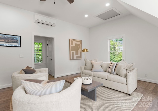236 Wales Ave, Charlotte, NC 28209 - living area with an AC wall unit, wood finished floors, baseboards, ceiling fan, and vaulted ceiling