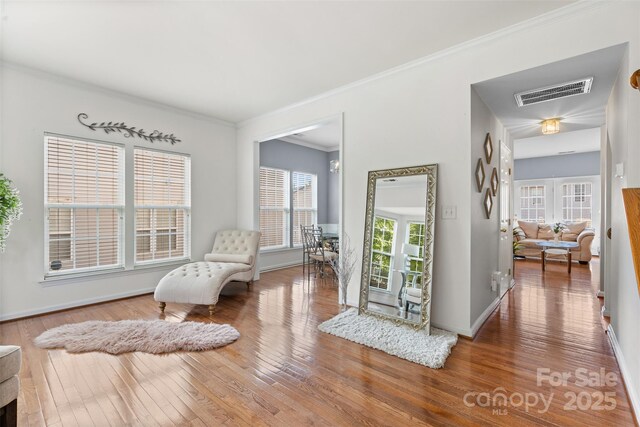 9775 Mallard Glen Dr, Charlotte, NC 28262 - living area featuring hardwood / wood-style flooring, ornamental molding, and baseboards
