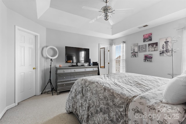 9775 Mallard Glen Dr, Charlotte, NC 28262 - bedroom with a raised ceiling, carpet flooring, baseboards, and ceiling fan