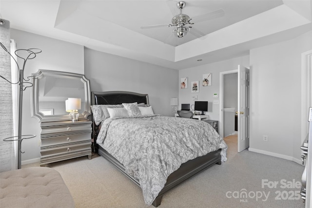 9775 Mallard Glen Dr, Charlotte, NC 28262 - bedroom with light carpet, a raised ceiling, baseboards, and ceiling fan