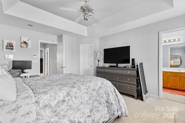 9775 Mallard Glen Dr, Charlotte, NC 28262 - bedroom featuring a tray ceiling, light colored carpet, and ensuite bathroom