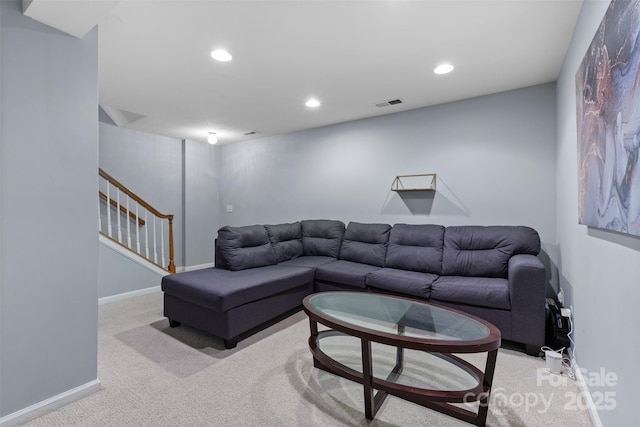 9775 Mallard Glen Dr, Charlotte, NC 28262 - carpeted living room with recessed lighting, stairway, and baseboards