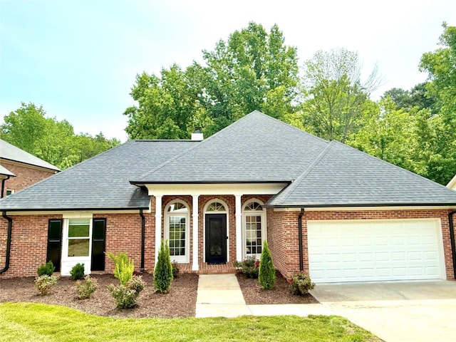 456 Brook Valley Ct NE, Concord, NC 28025 - view of front of property with an attached garage, a shingled roof, driveway, and brick siding