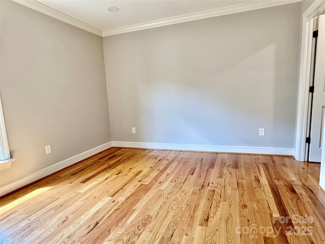 456 Brook Valley Ct NE, Concord, NC 28025 - spare room with baseboards, ornamental molding, and light wood-style floors