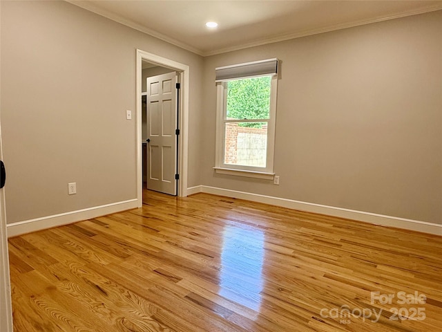 456 Brook Valley Ct NE, Concord, NC 28025 - empty room featuring crown molding, baseboards, light wood-style floors, and recessed lighting