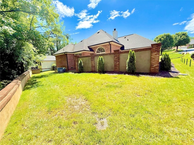 456 Brook Valley Ct NE, Concord, NC 28025 - rear view of house with brick siding, a chimney, and a shingled roof