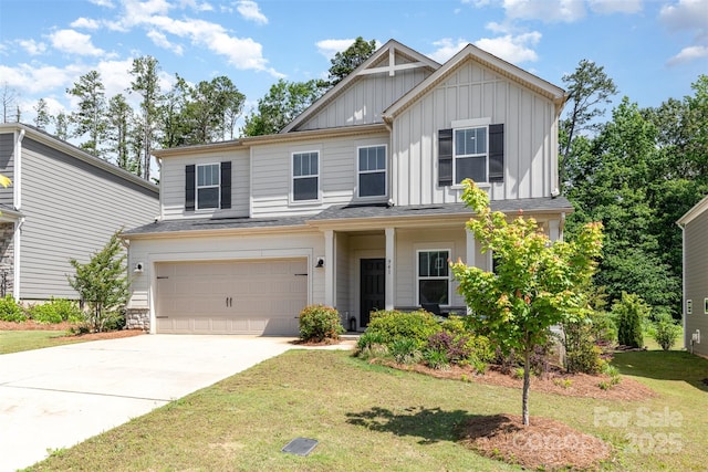 941 Rachel Anne Dr, Belmont, NC 28012 - view of front of home featuring board and batten siding, a garage, a front lawn, and concrete driveway