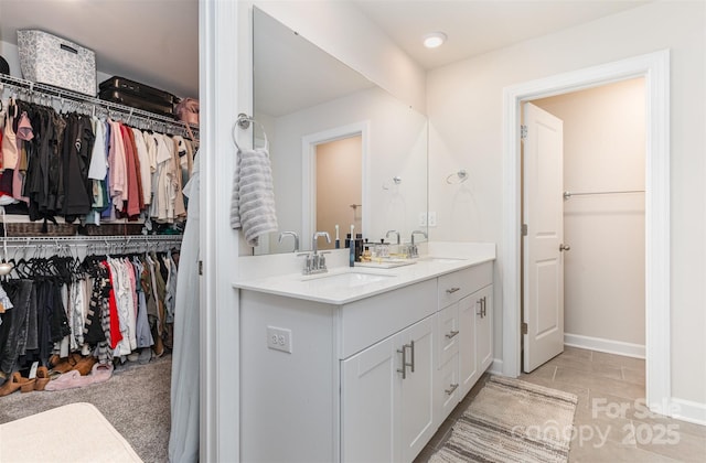 941 Rachel Anne Dr, Belmont, NC 28012 - full bath featuring double vanity, a spacious closet, and baseboards