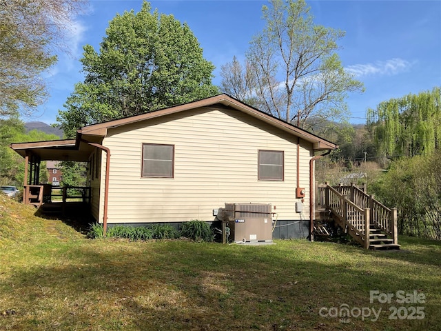 45 Old Cove Rd, Sylva, NC 28779 - view of home's exterior with central AC unit, a yard, and stairs