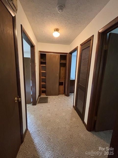 45 Old Cove Rd, Sylva, NC 28779 - hallway featuring carpet floors, a textured ceiling, and an AC wall unit
