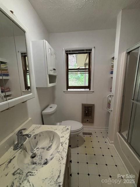 45 Old Cove Rd, Sylva, NC 28779 - bathroom featuring heating unit, toilet, a textured ceiling, and vanity