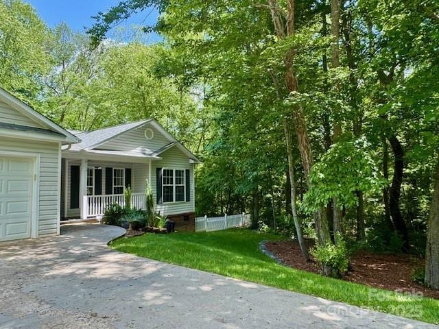 117 N River Glen Dr, Morganton, NC 28655 - view of front of property featuring covered porch, a garage, driveway, and fence