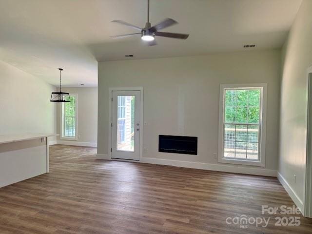117 N River Glen Dr, Morganton, NC 28655 - unfurnished living room with wood finished floors, a fireplace, a ceiling fan, and baseboards