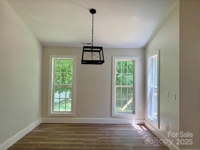 117 N River Glen Dr, Morganton, NC 28655 - unfurnished dining area featuring healthy amount of natural light, baseboards, and wood finished floors