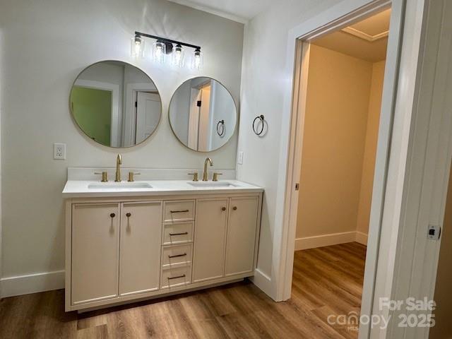 117 N River Glen Dr, Morganton, NC 28655 - bathroom featuring wood finished floors, baseboards, and double vanity