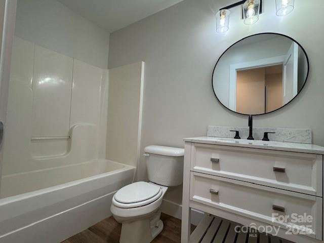 117 N River Glen Dr, Morganton, NC 28655 - full bathroom featuring wood finished floors, toilet, vanity, bathtub / shower combination, and baseboards