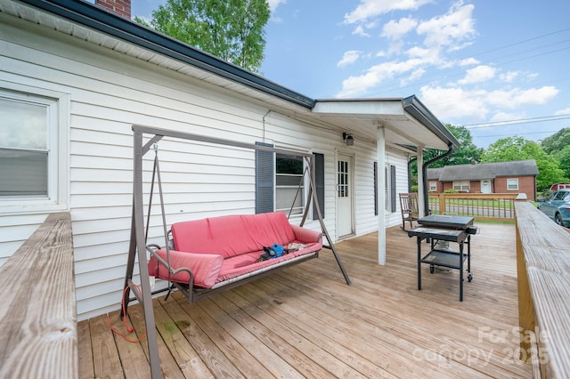 wooden deck with outdoor lounge area