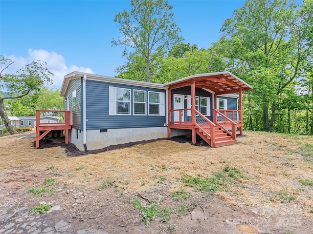 255 Thompson Cove Rd, Clyde, NC 28721 - manufactured / mobile home featuring crawl space and a deck