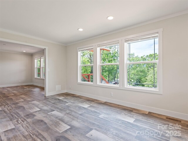 255 Thompson Cove Rd, Clyde, NC 28721 - spare room featuring crown molding, baseboards, wood finished floors, and recessed lighting