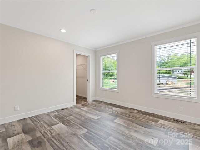 255 Thompson Cove Rd, Clyde, NC 28721 - empty room with baseboards, wood finished floors, crown molding, and recessed lighting