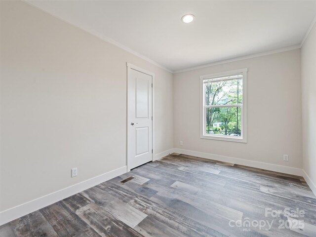 255 Thompson Cove Rd, Clyde, NC 28721 - spare room featuring ornamental molding, baseboards, wood finished floors, and recessed lighting