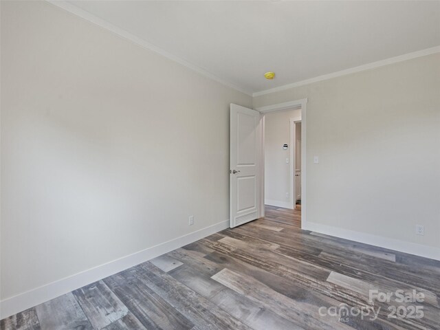 255 Thompson Cove Rd, Clyde, NC 28721 - empty room featuring wood finished floors, crown molding, and baseboards
