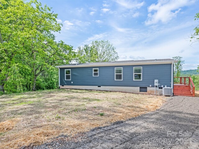 255 Thompson Cove Rd, Clyde, NC 28721 - rear view of house featuring a deck and cooling unit