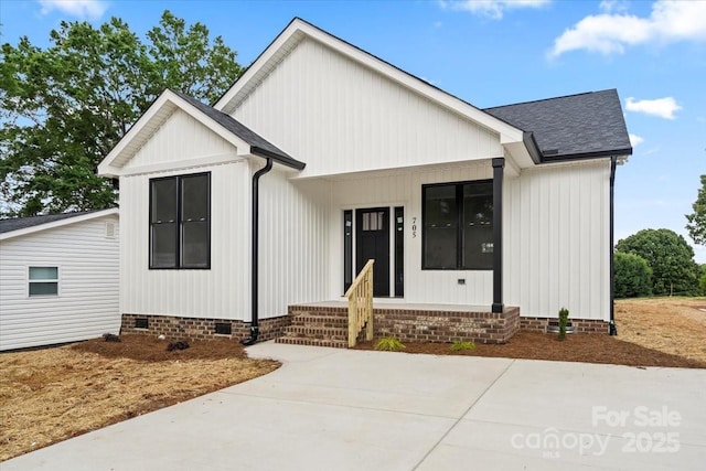 modern farmhouse with crawl space and roof with shingles