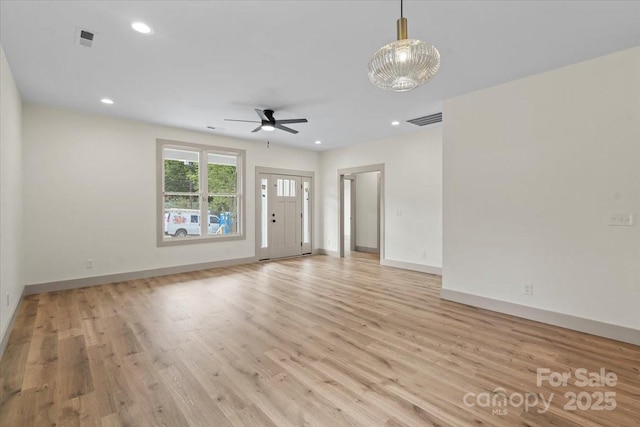 unfurnished living room featuring ceiling fan, light wood-type flooring, baseboards, and recessed lighting