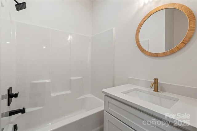 bathroom with vanity and  shower combination