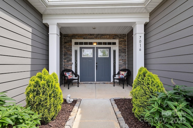 7016 Bareland Rd, Fort Mill, SC 29707 - property entrance with stone siding and a porch