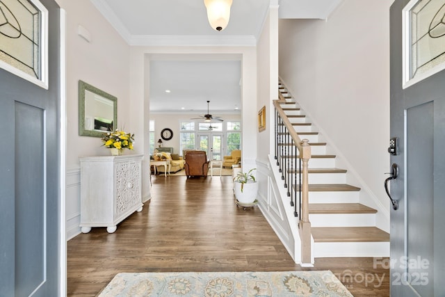 7016 Bareland Rd, Fort Mill, SC 29707 - foyer with stairs, wood finished floors, a ceiling fan, and crown molding