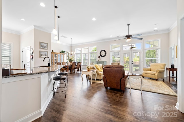 7016 Bareland Rd, Fort Mill, SC 29707 - living room with plenty of natural light, a ceiling fan, dark wood-type flooring, recessed lighting, and crown molding