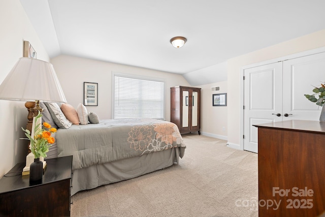 7016 Bareland Rd, Fort Mill, SC 29707 - bedroom featuring lofted ceiling, light colored carpet, and baseboards