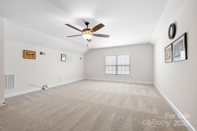 7016 Bareland Rd, Fort Mill, SC 29707 - unfurnished room with ceiling fan, light carpet, vaulted ceiling, and baseboards