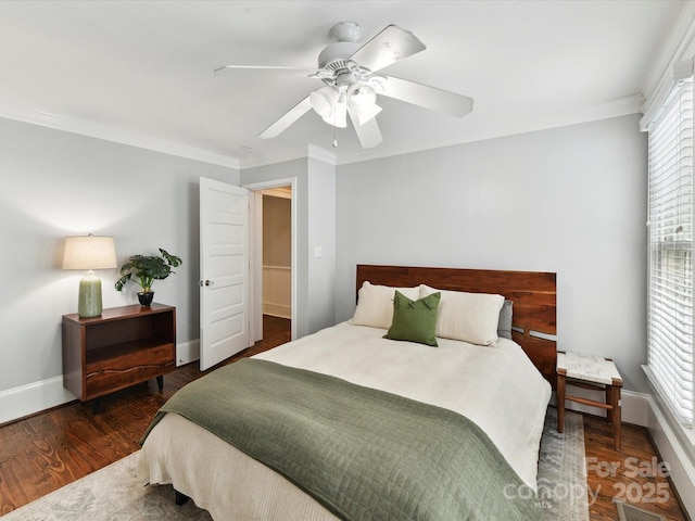 bedroom featuring crown molding, baseboards, ceiling fan, and wood finished floors