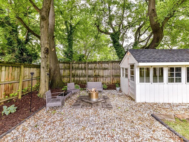 fenced backyard featuring an outdoor structure