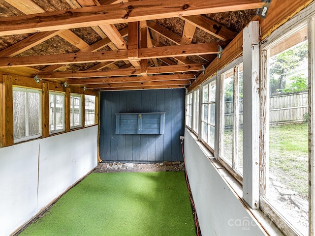 unfurnished sunroom featuring lofted ceiling