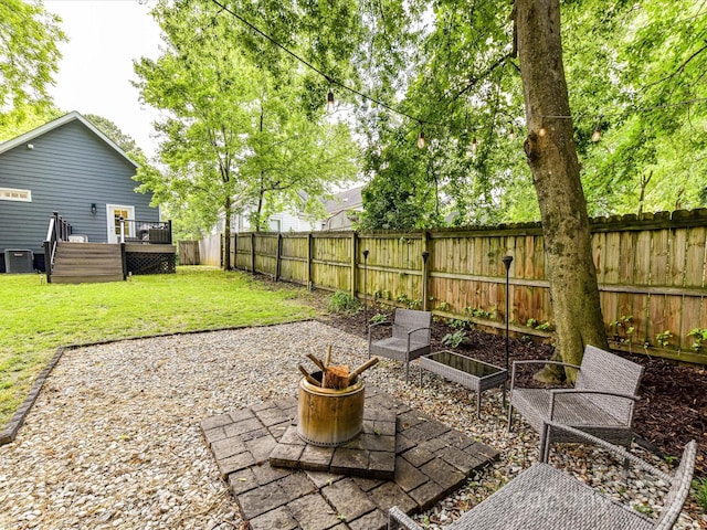 view of patio / terrace with cooling unit and a deck