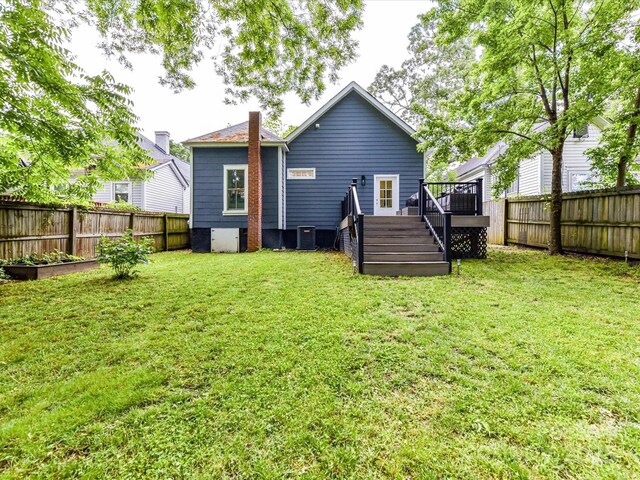 back of property with a deck, central AC, and stairway