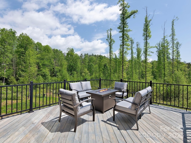 85 S Fork Trl, Lake Toxaway, NC 28747 - deck featuring an outdoor living space with a fire pit and a forest view