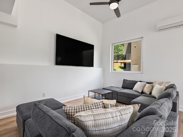 85 S Fork Trl, Lake Toxaway, NC 28747 - living room with a wall unit AC, wood finished floors, ceiling fan, and baseboards