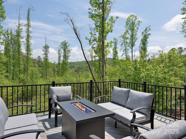 85 S Fork Trl, Lake Toxaway, NC 28747 - wooden deck with an outdoor living space with a fire pit and a view of trees