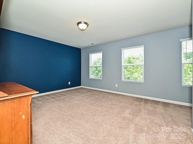 9027 Gray Willow Rd, Charlotte, NC 28227 - unfurnished room featuring healthy amount of natural light, carpet flooring, and baseboards