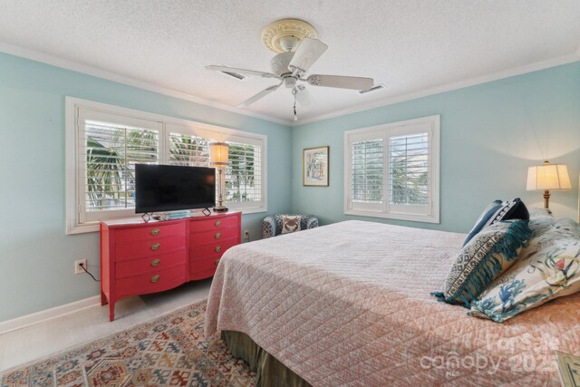 bedroom featuring crown molding, ceiling fan, a textured ceiling, and baseboards