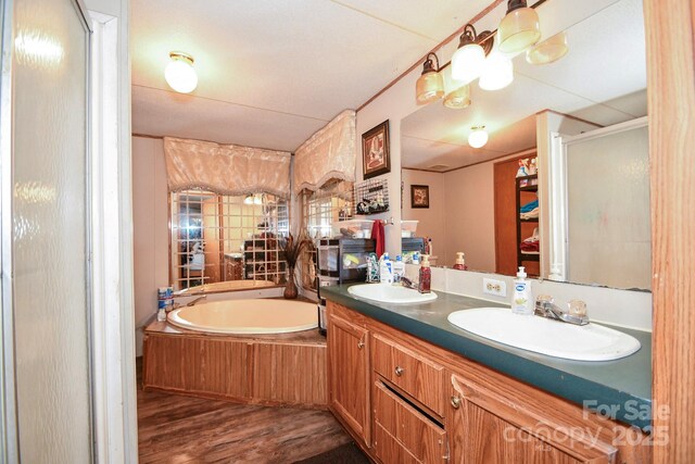 1574 Burke Duncan Rd, Lancaster, SC 29720 - full bathroom with a bath, a stall shower, double vanity, and wood finished floors