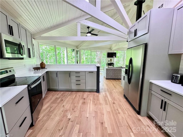 164 Johnson Ridge Rd, Elkin, NC 28621 - kitchen featuring stainless steel appliances, gray cabinetry, light countertops, and wooden ceiling