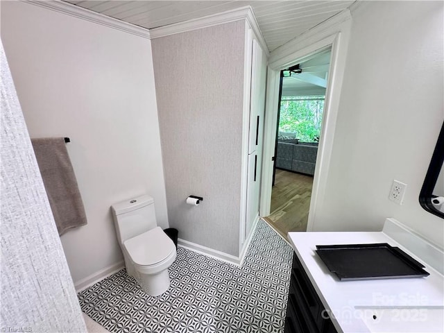 164 Johnson Ridge Rd, Elkin, NC 28621 - bathroom featuring baseboards, toilet, vanity, and ornamental molding